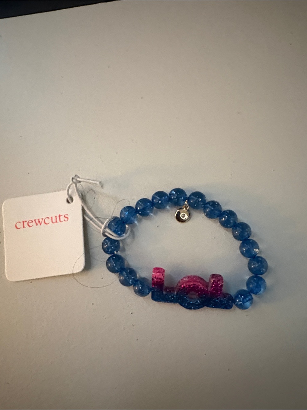 JCREW/ CREWCUTS 
Kids Blue Beaded Bracelet with Pink 'lol' Charm